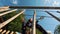 Happy Little Girl Playing in Tarzan Attraction on Playground in Amusement Park