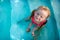 Happy little girl in a pool