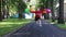 Happy little girl in skirt runs and jumps with balloons