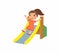 Happy little girl slides off a children`s slide. Joyful child, summer vacation. Ð¡oncept of vacation and entertainment on the