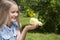 Happy little girl with a small chicken