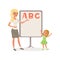 Happy little girl and teacher standing next to blackboard with ABC letters. Kid learning alphabet. Lesson in