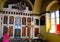 Happy little girl on vacation in Mykonos admires a small church, Cyclades