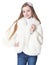 Happy little girl in white furry coat posing