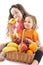 Happy little girls with basket of fruits