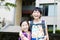 Happy little girls with classmates having fun at the School