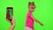 Happy little kid girl blogger front of phone camera record video enjoy dance content on chroma key