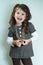 Happy little kid girl with gold chain on white background