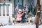 Happy little kids sitting on the porch of the Christmas decorated house outdoor