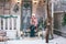 Happy little kids sitting on the porch of the Christmas decorated house outdoor