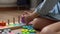 Happy Little Preschool Toothless Girl Playing With Colored Wooden Toy. Cute Kids Learn To Count By Playing Teaches