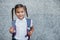 Happy little schoolgirl with backpack . Back to school