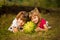Happy little sisters lie on grass and hug very big watermelon in sunny day. Healthy concept