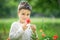 Happy little smiling boy standing and smiling in poppy field