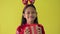 Happy long hair pretty girl in red sweater and wearing reindeer antlers headband received a Christmas gift box.