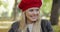 Happy-looking woman in red beret