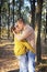 Happy love couple walking in forest and kissing, young adult romantic couple, casual wear