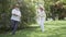 Happy in love senior couple dancing in summer park