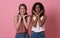Happy loving lesbian couple good time together isolated on pink background. LGBT concept