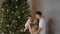 Happy loving tender family together celebrating New Year holiday, Christmas tree