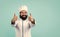 happy male chef in hat with beard and moustache on blue background, thumbs up for success and perfection