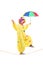 Happy male clown with umbrella walking on a rope