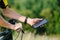 Happy male cyclist sending a text message on his mobile phone. Image of a cyclist on a mountain bike using a smartphone navigator