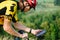 Happy male cyclist sending a text message on his mobile phone. Image of a cyclist on a mountain bike using a smartphone navigator