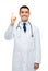 Happy male doctor in white coat pointing finger up