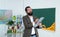 Happy male lecturer with workbook and books ready for lesson, school