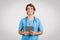 Happy male nurse with tablet, healthcare technology