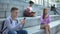 Happy male student playing smartphone game outdoors, gadget addiction, chat