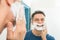 Happy man applying shaving cream