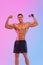 Happy man athlete with dumbbell isolated on pink background. Gym full body workout. Muscular man athlete in fitness gym