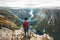 Happy Man backpacker on mountain summit traveling