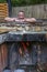 Happy man bathing in the cast iron vat with mineral water containing hydrogen sulphide. Water in cast iron vats heated to 40-45