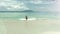 Happy man on beach at Seychelles coming out from the sea.