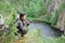 Happy man with camera on the top of taiga forest.