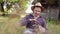 a happy man of Caucasian appearance, a farmer holds and hugs his favorite goat. a small goat.