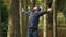 Happy man emotionally enjoys nature. loudly screaming raising her hands up