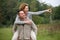 Happy man giving smiling woman piggyback ride