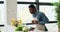 Happy man having fun while preparing food in kitchen