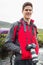 Happy man on a hike with a camera around his neck