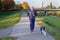 Happy man jogging in evening light with his Border Collie dog
