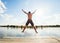 Happy man jumping on pier