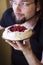 Happy man with pavlova cake