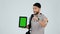 Happy man, personal trainer and tablet with green screen, sign up or mockup against a studio background. Portrait male