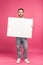 happy man posing with blank board, isolated