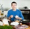 Happy man preparing batter