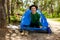 A Happy Man Puts Up A Tent On The Site Of A Future Camp In The Forest